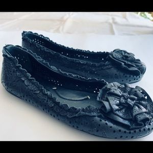 Artistic shoes with a bow  looking like a flower